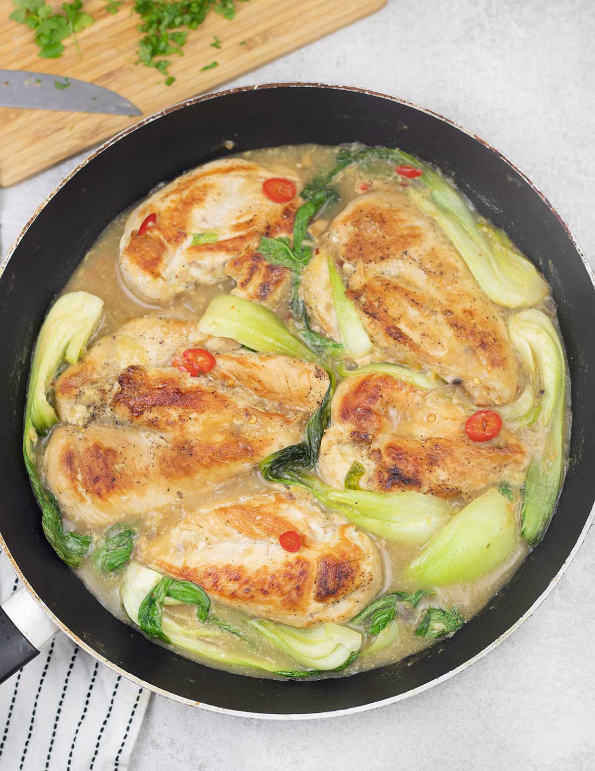 Overheat shot to Lime Coconut Chicken in a skillet