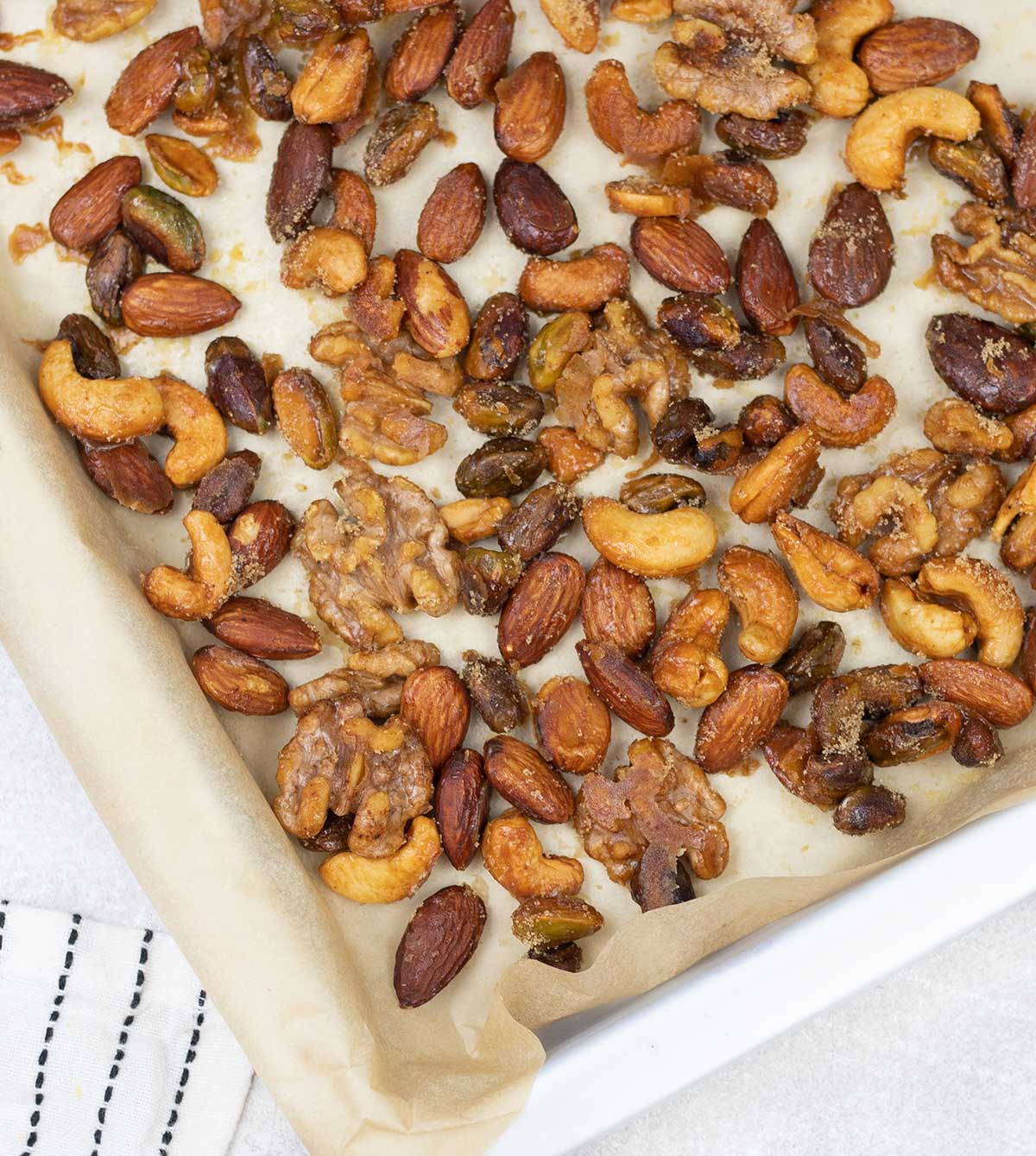 Honey Roasted Mixed Nuts on a baking tray.