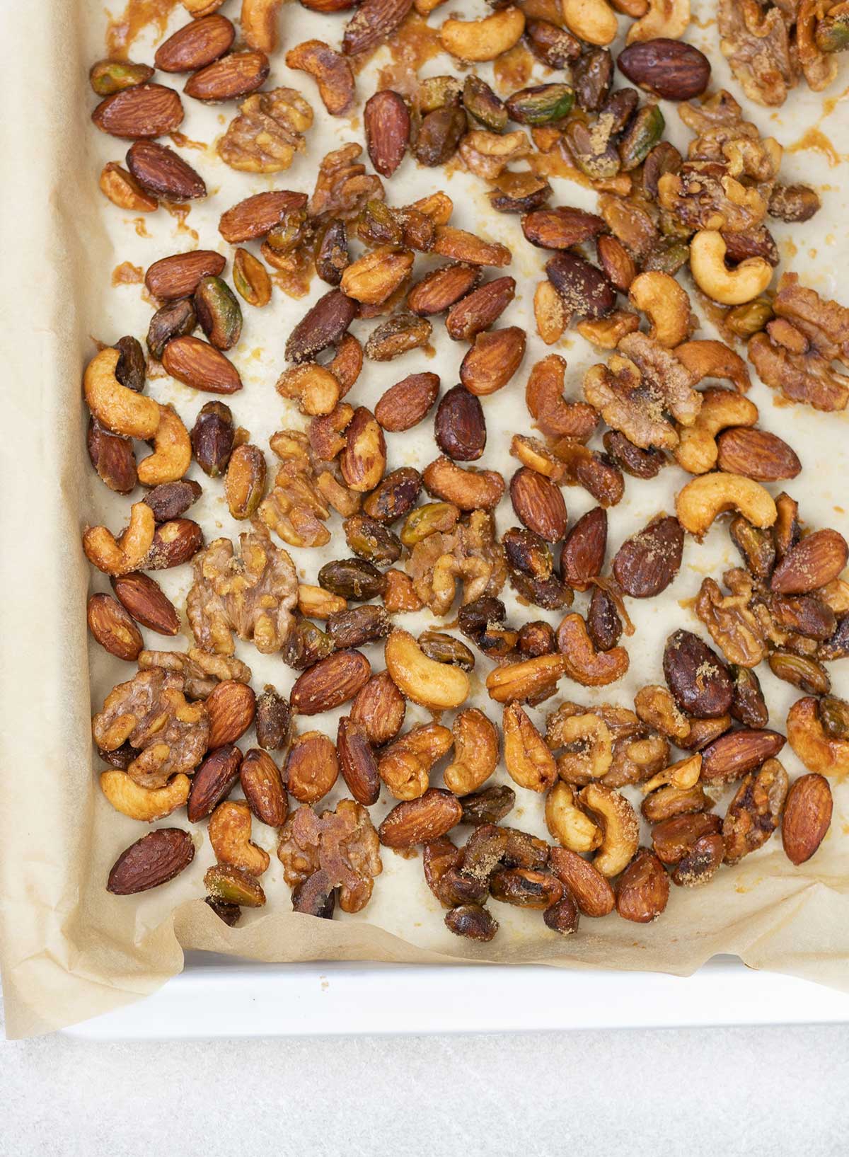 Honey Roasted Mixed Nuts on a baking sheet.