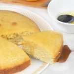 Orange Drizzle Cake and an orange is in the background