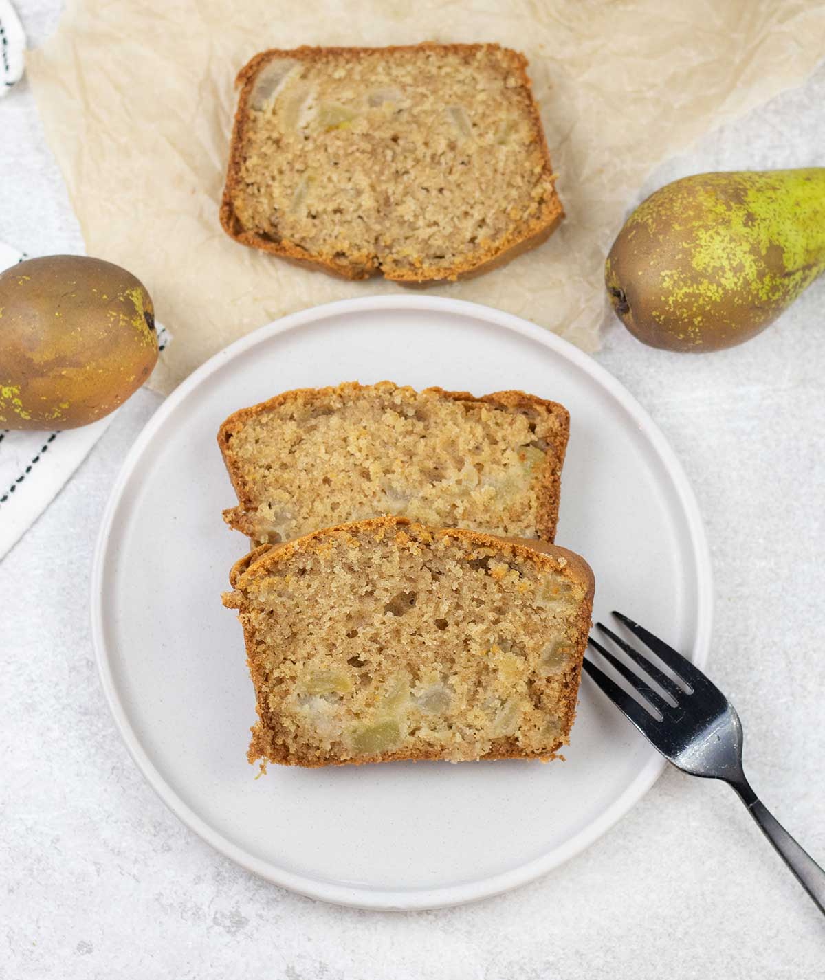 Pear Bread slices and some pears around it