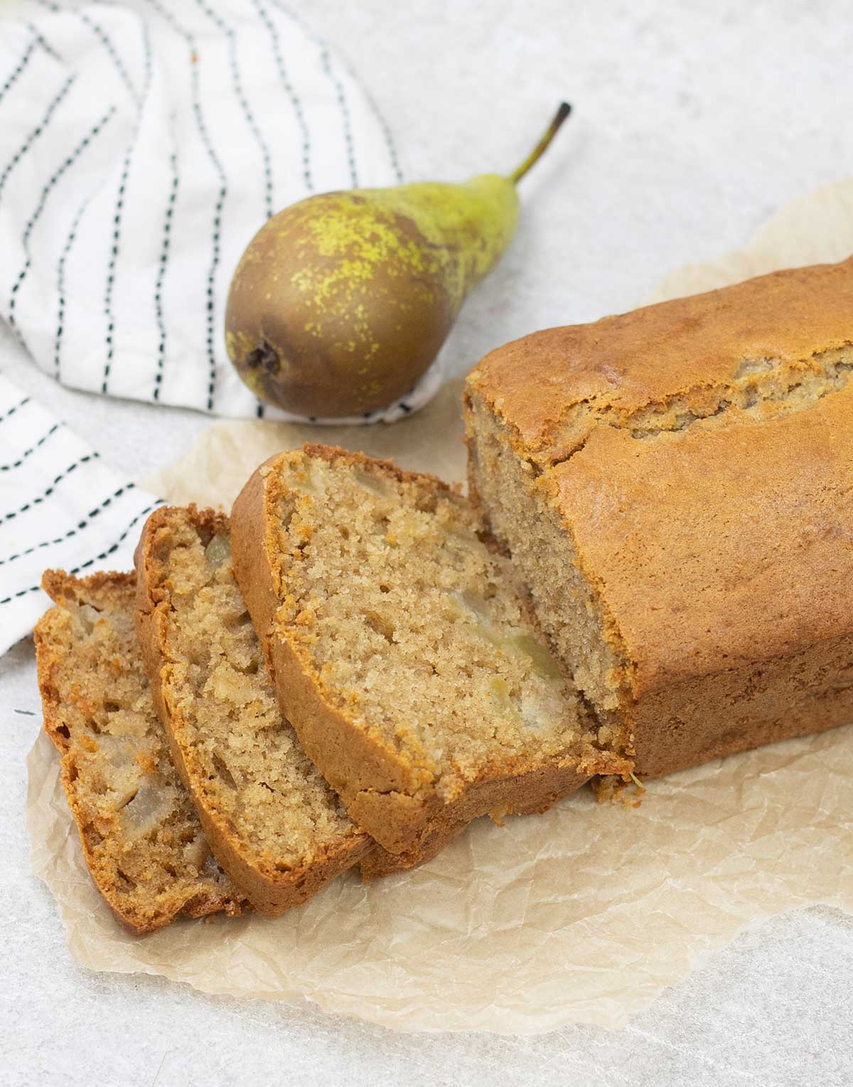 Pear Bread slices and some pears around it