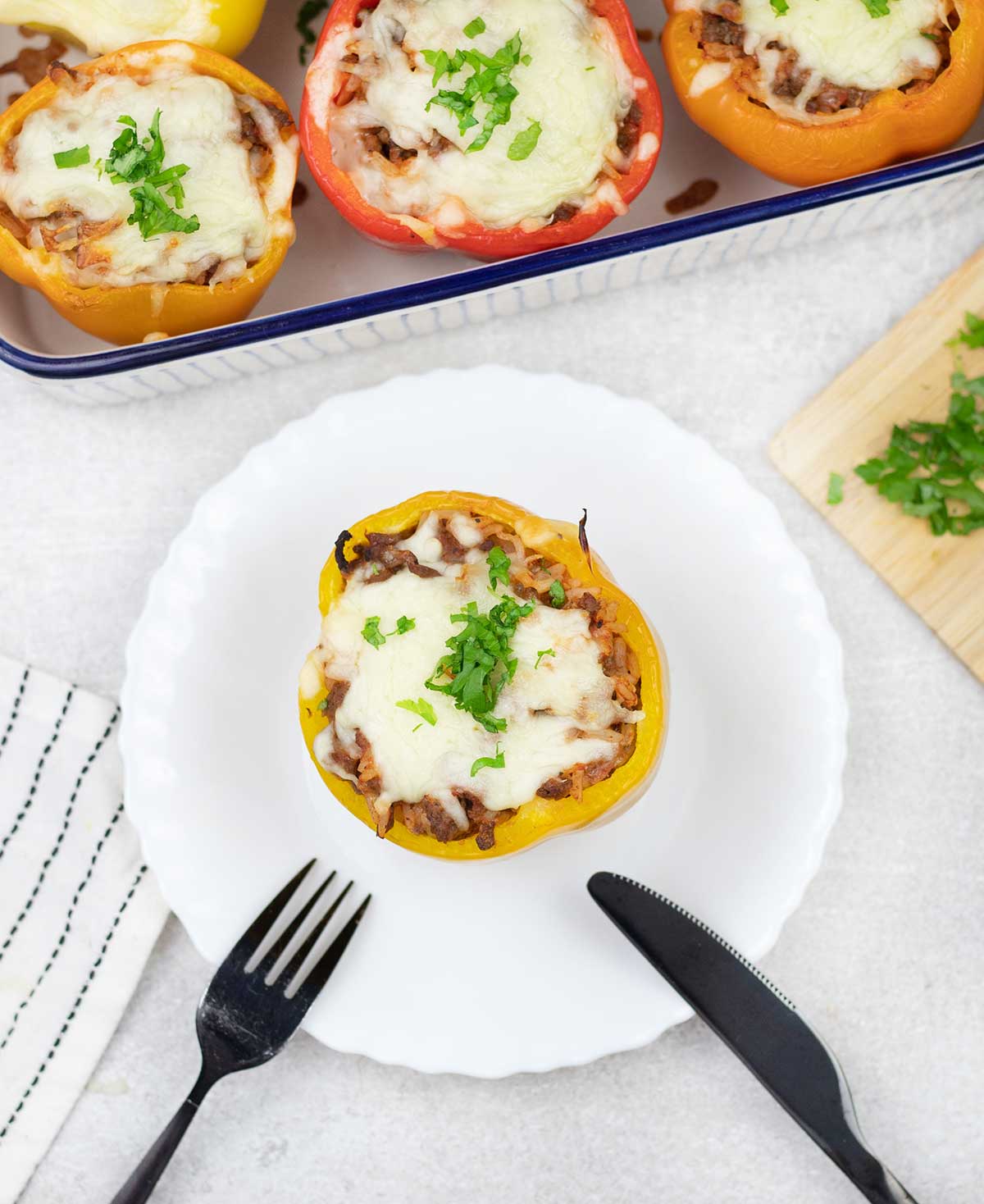 Baked stuffed bell pepper in a plate.