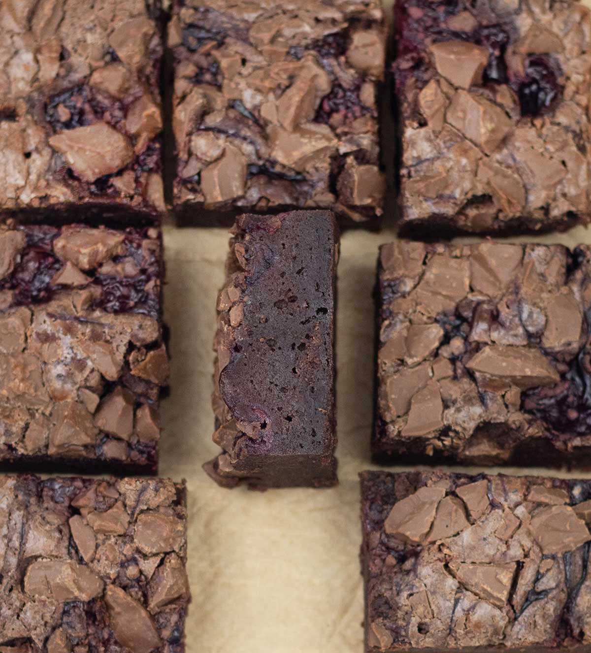 Brownies with cherry pie filling cut into squares.