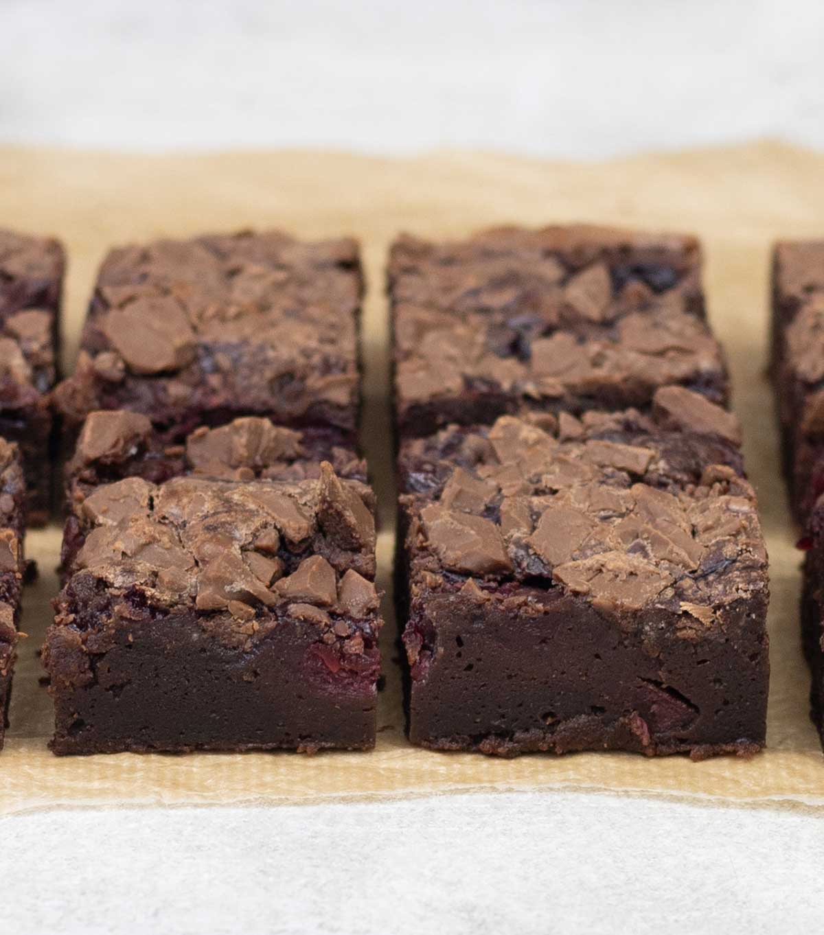 Brownies with cherry pie filling cut into squares.