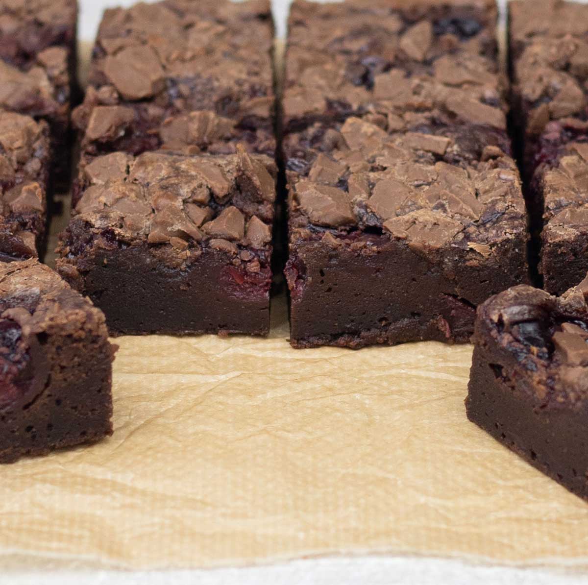 Squares of brownies with cherry pie filling.