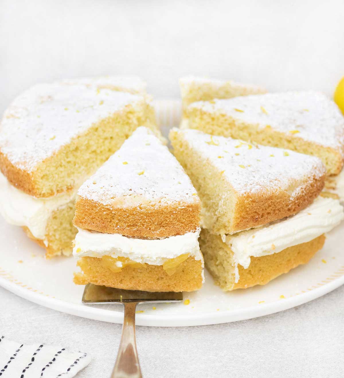 Slices of lemon Victoria sponge cake.