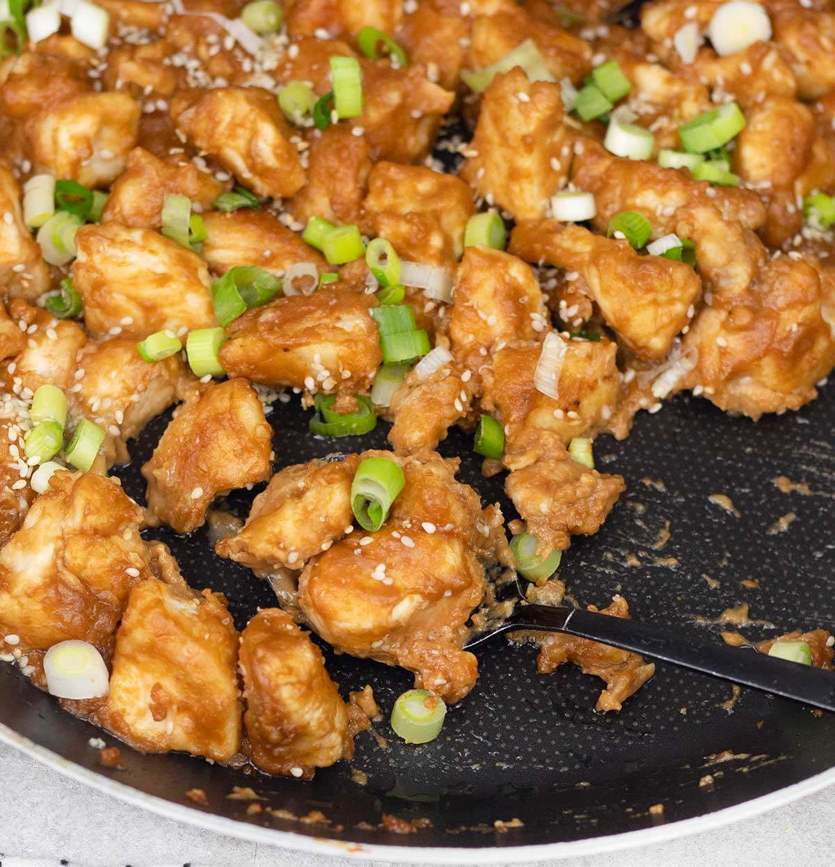 Chinese peanut butter chicken in a pan.