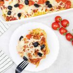 Pizza spaghetti bake slice in a plate.