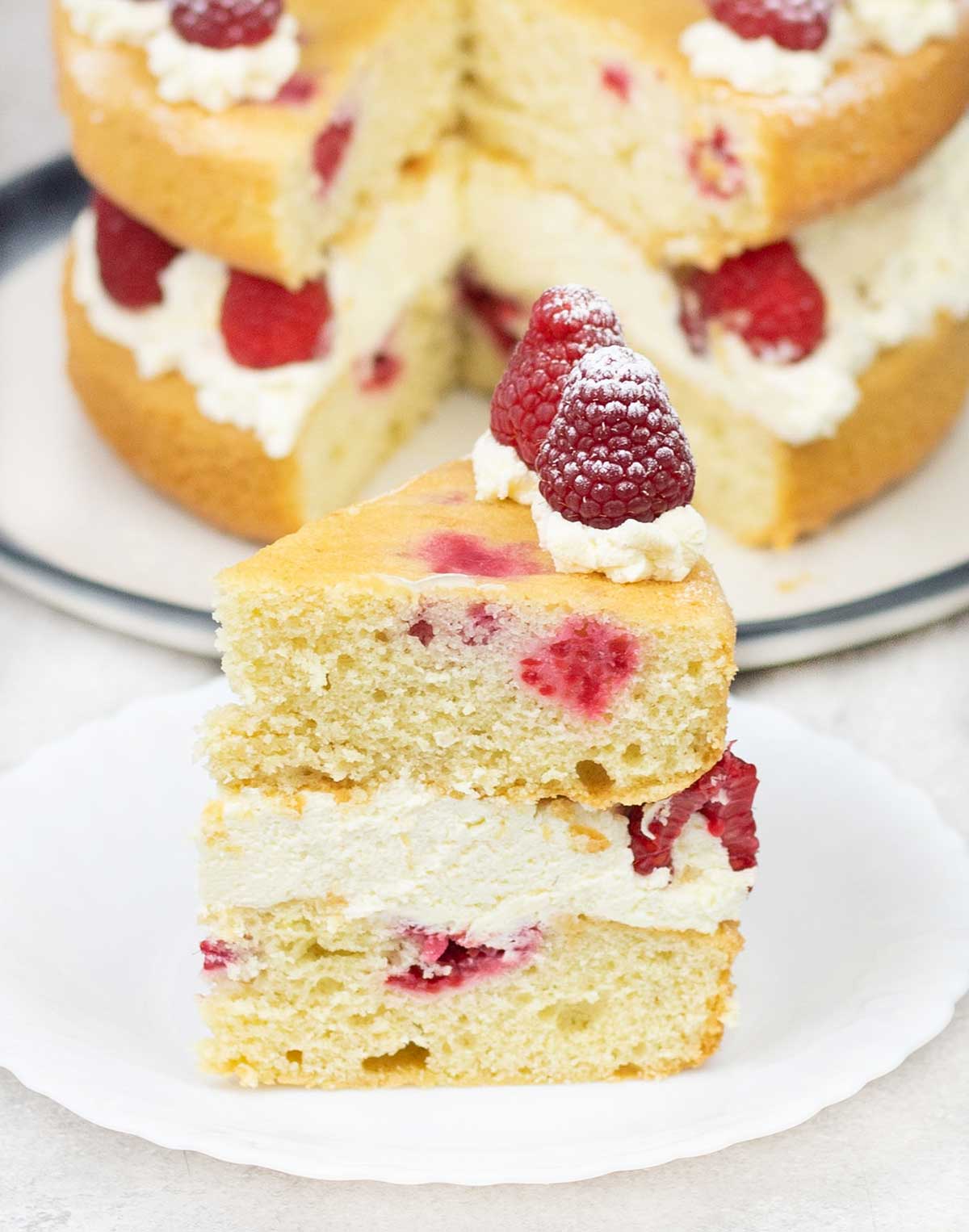 A slice of raspberry sponge cake.