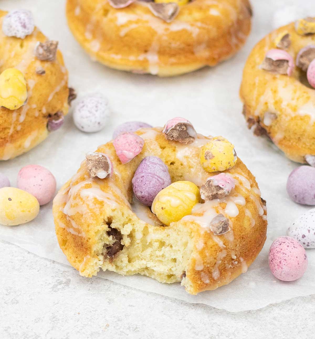 Eat one of the baked Easter donuts with mini eggs.