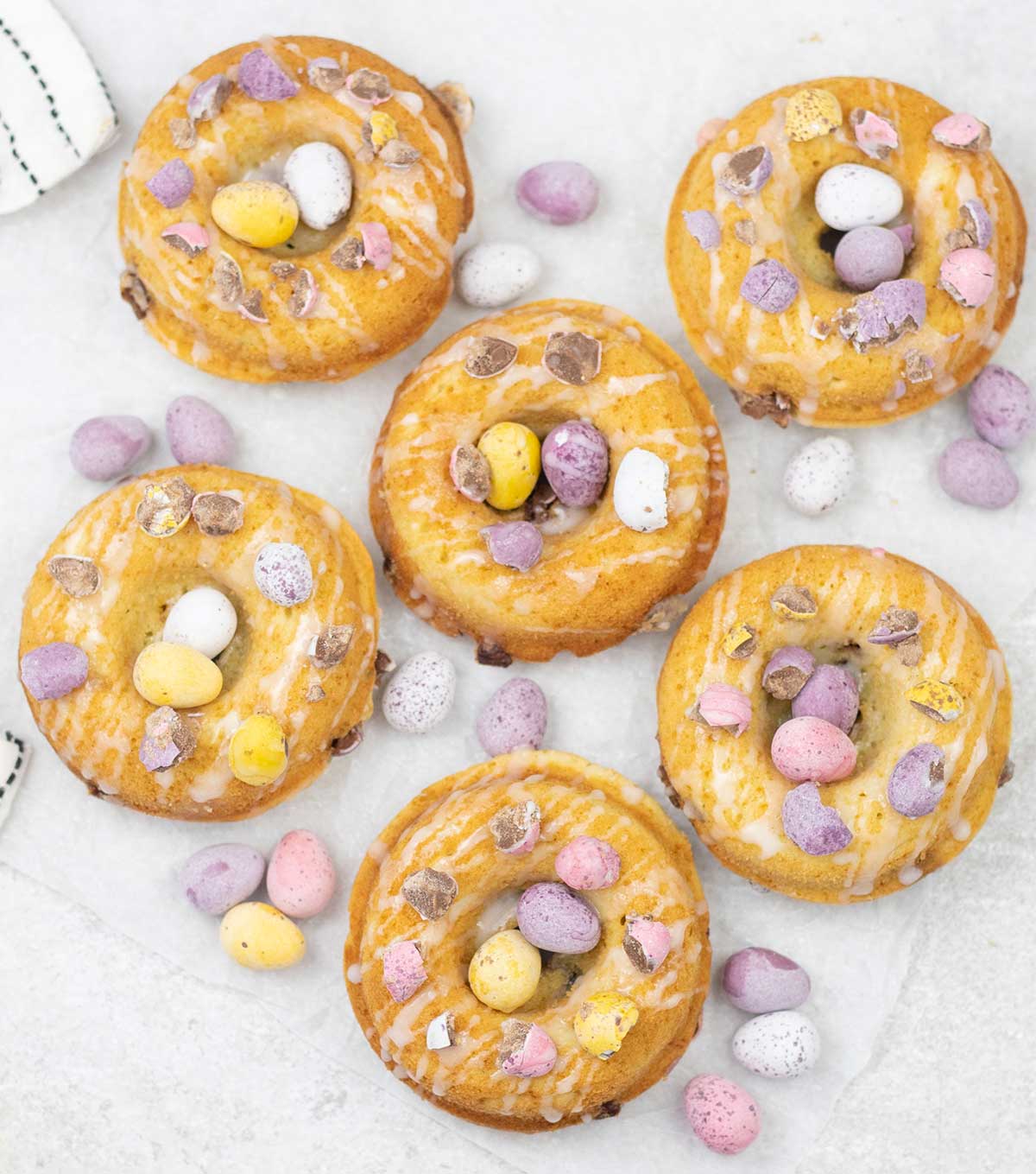 Baked Easter donuts with mini eggs.