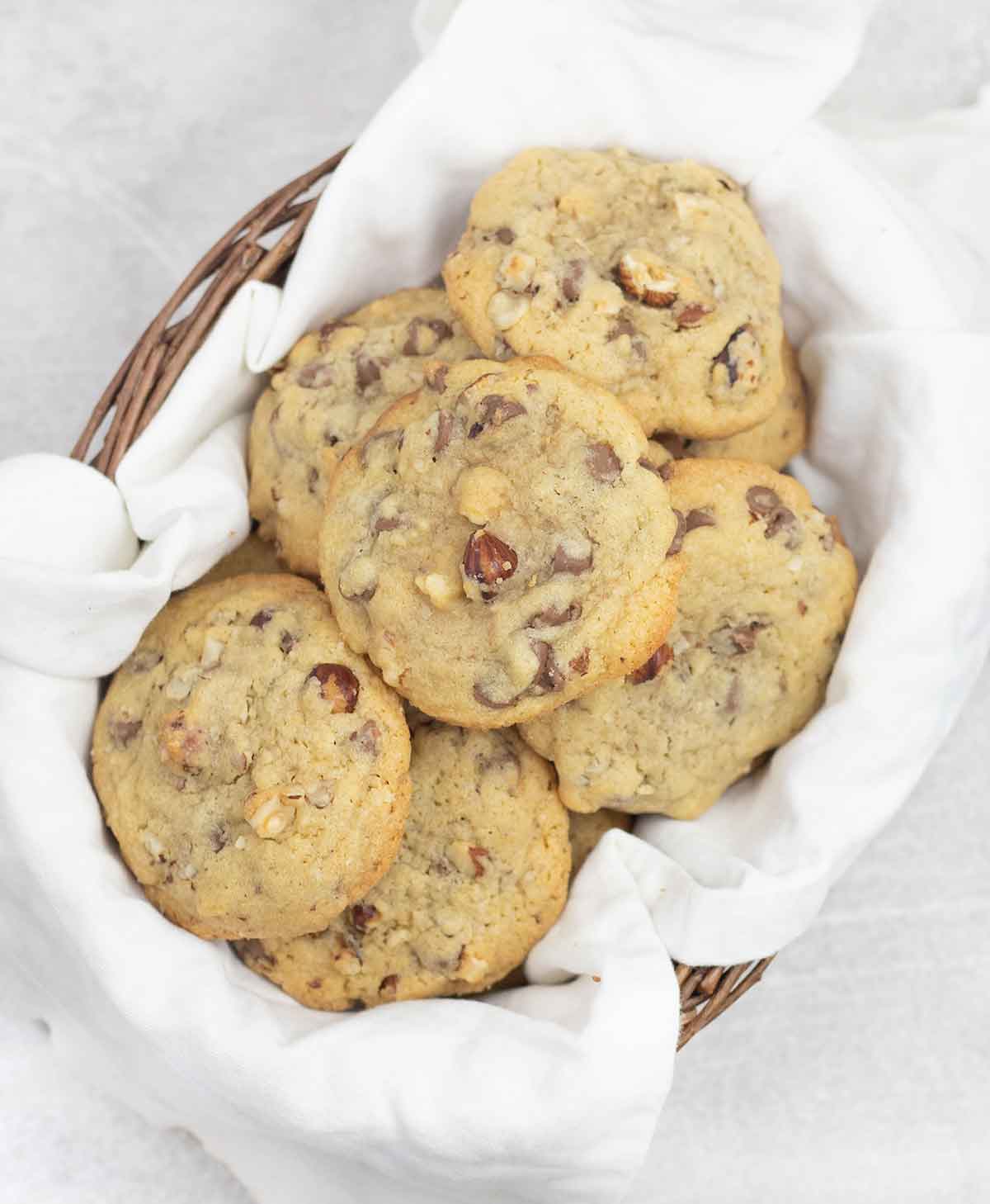 Hazelnut cookies with chocolate chips in a basket.
