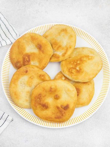 Caribbean johnny cakes in a serving plate.