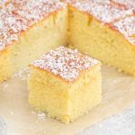 jam and coconut cake cut into squares.