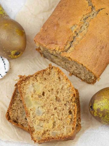 Pear Bread along with some pears around it.