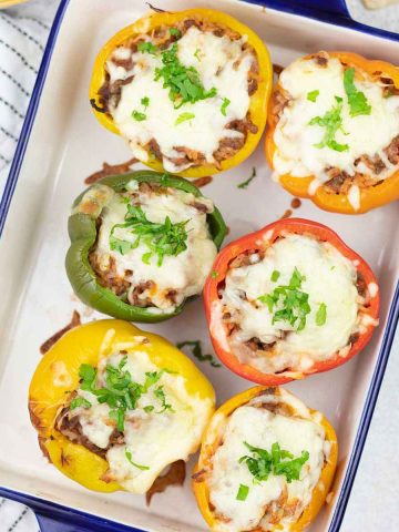 baked stuffed bell peppers in a baking pan.