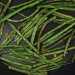 Pan fried green beans in a large nonstick pan.