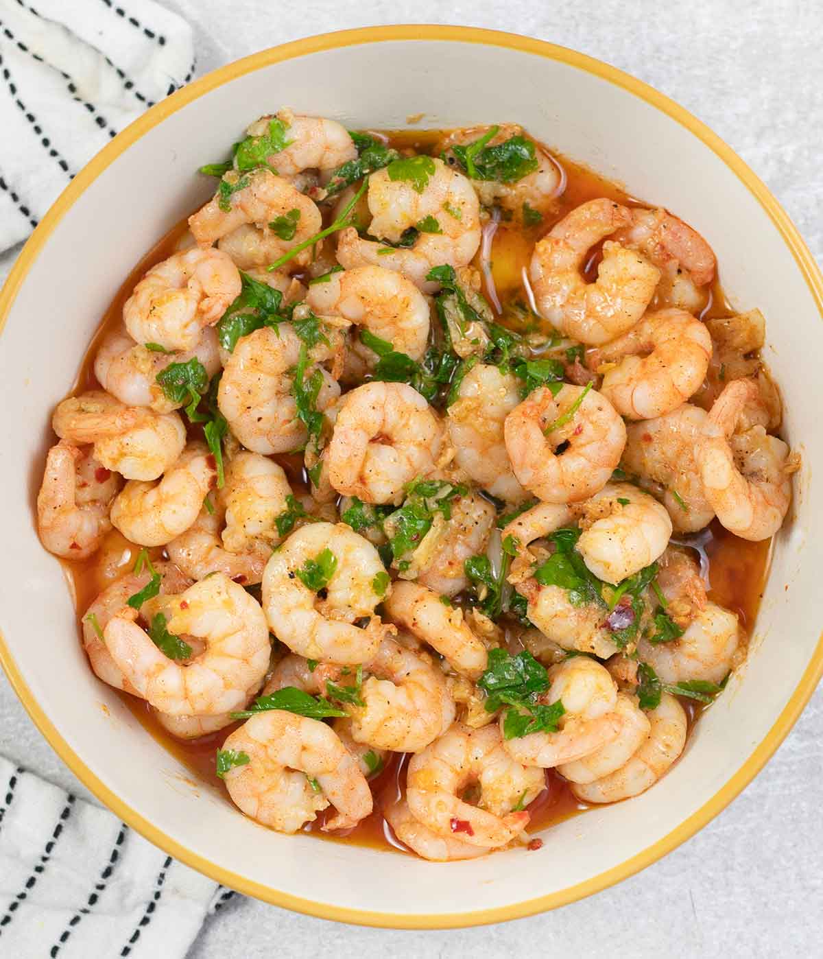 Garlic prawns in a large bowl.