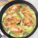 Lime coconut chicken in a large pan.