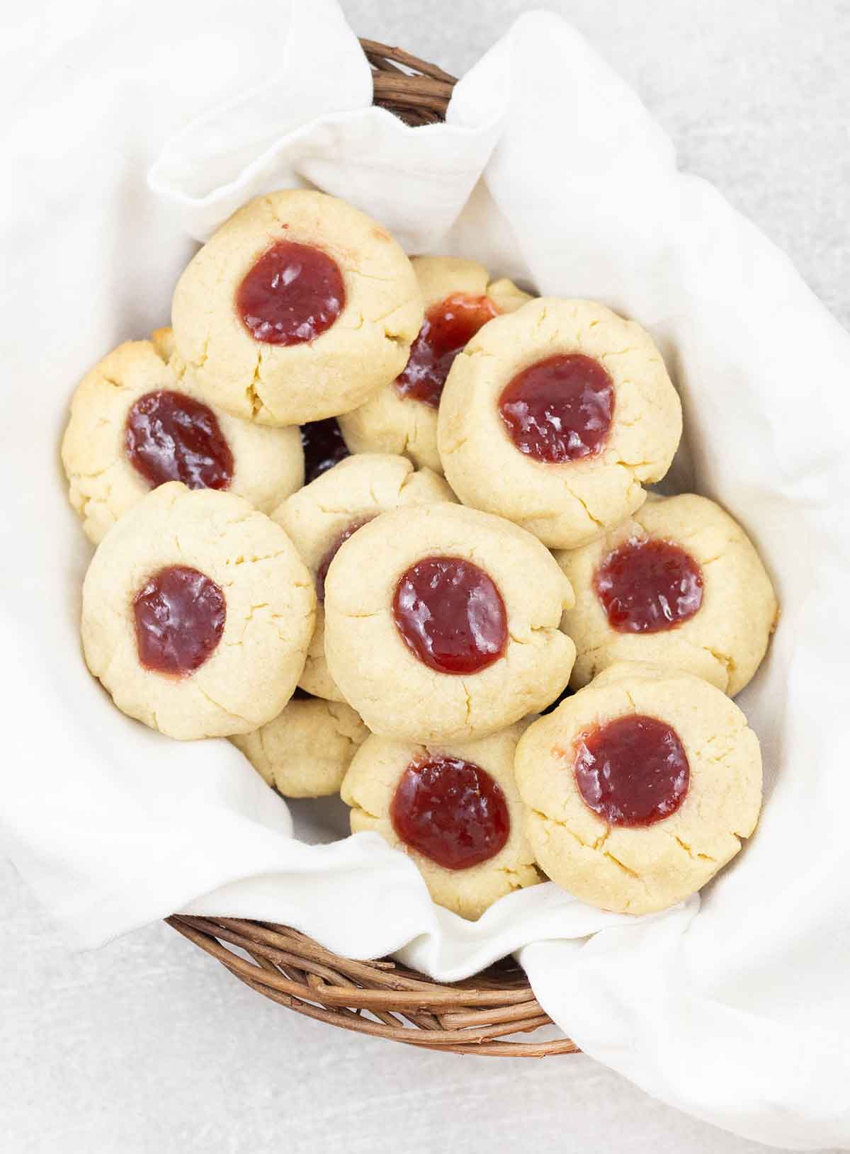 jam filled cookies in a small basket.