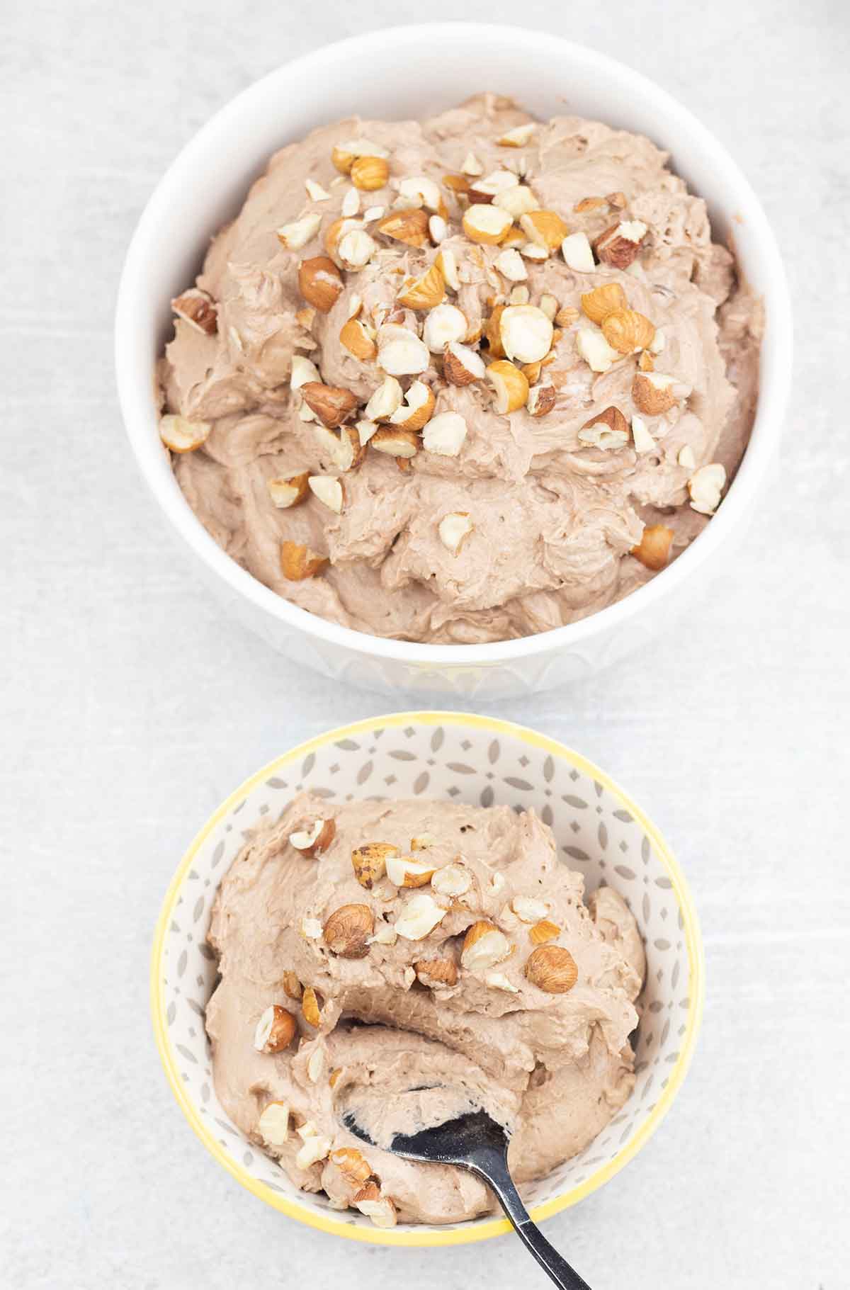 Nutella mousse in a a serving plate and large bowl.