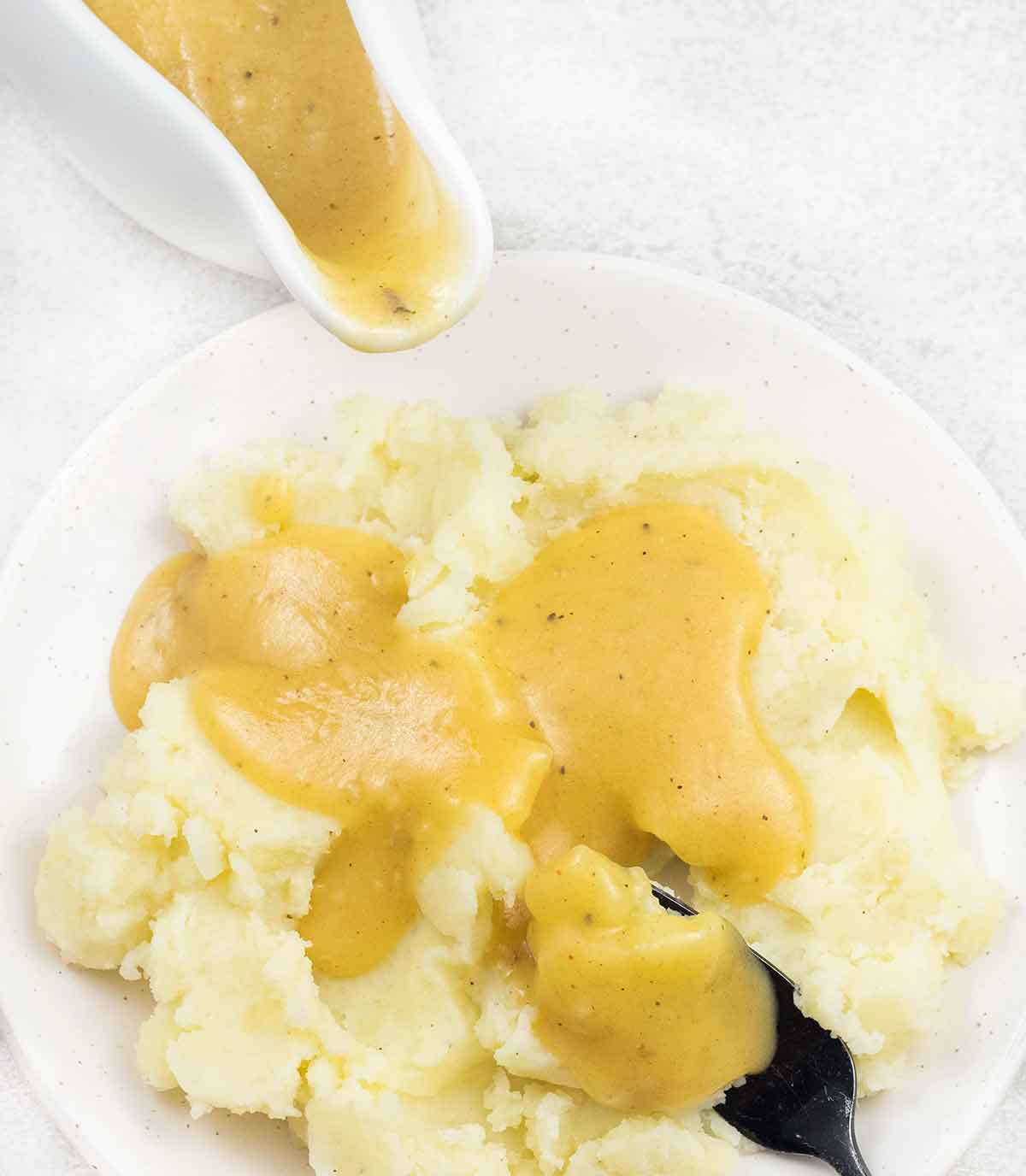 Pour the homemade chicken gravy on top of mashed potatoes.