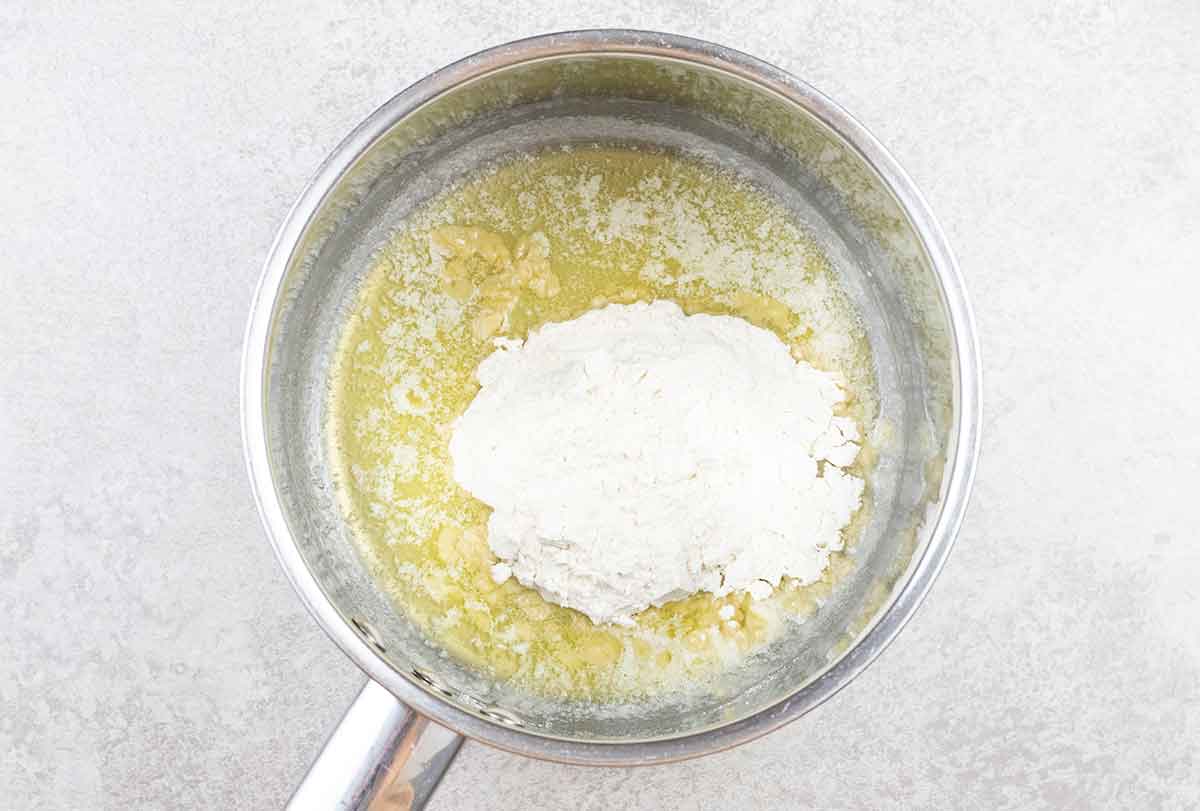 In a saucepan, melt the butter. Then, add the flour.