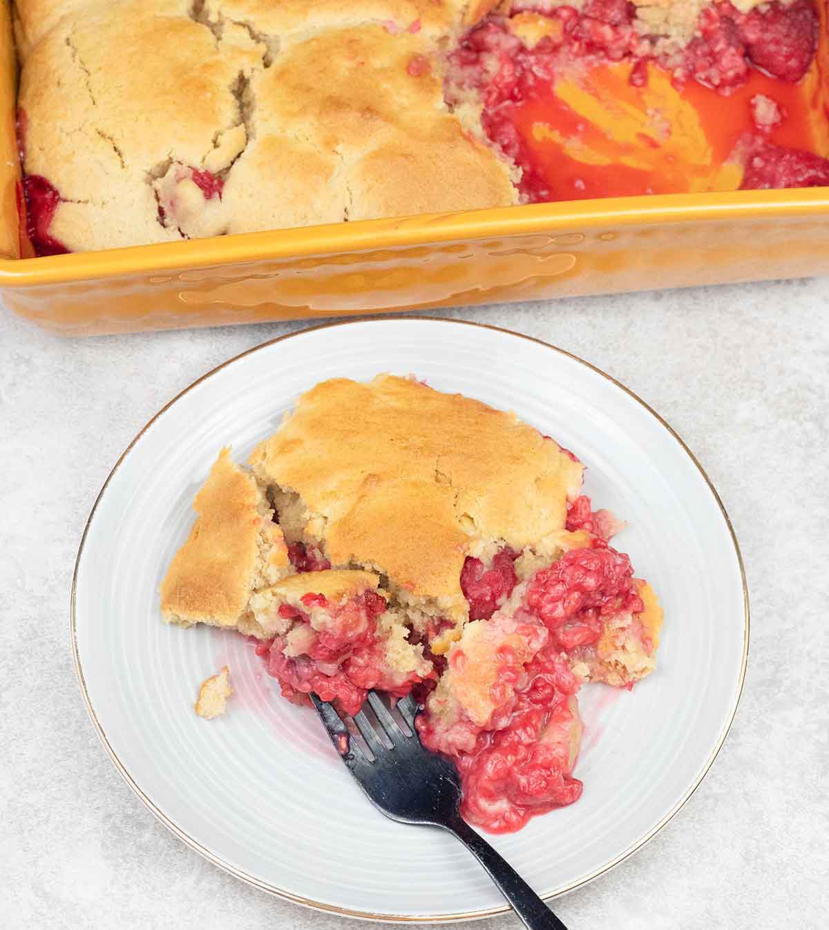 Raspberry cobbler in a serving plate.