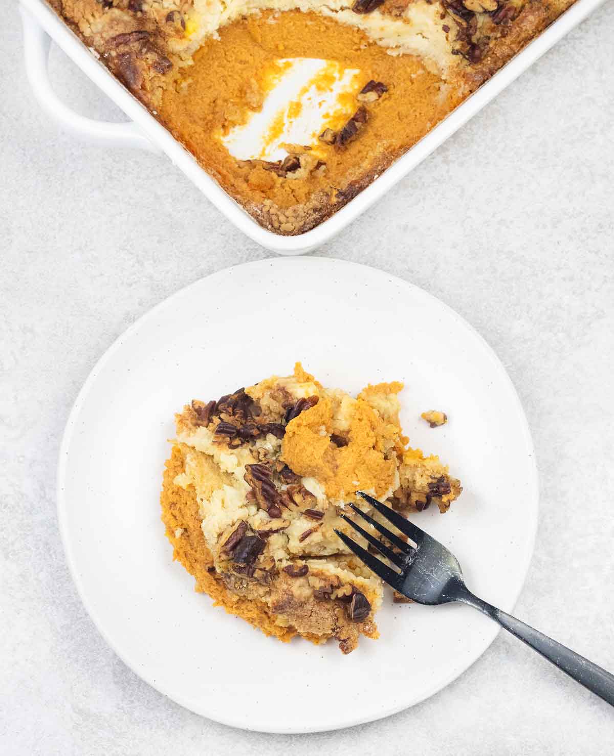 pumpkin dump cake in a serving plate.