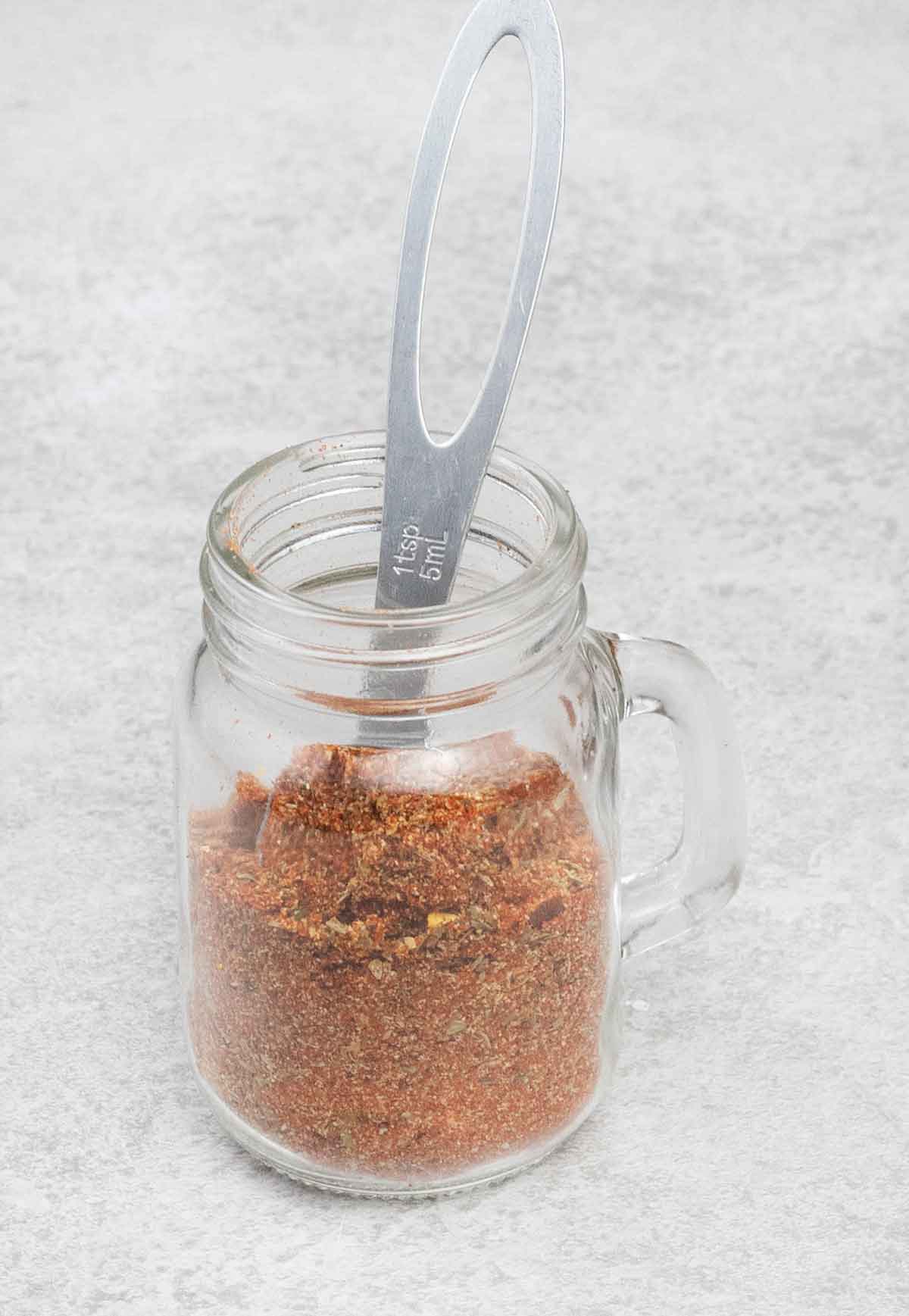 Salmon seasoning in a glass jar.