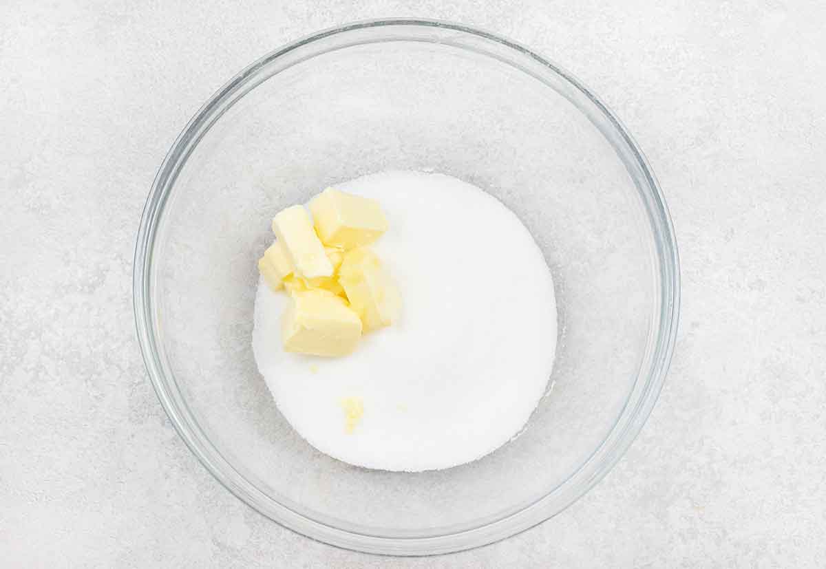 Butter and sugar in a mixing bowl.