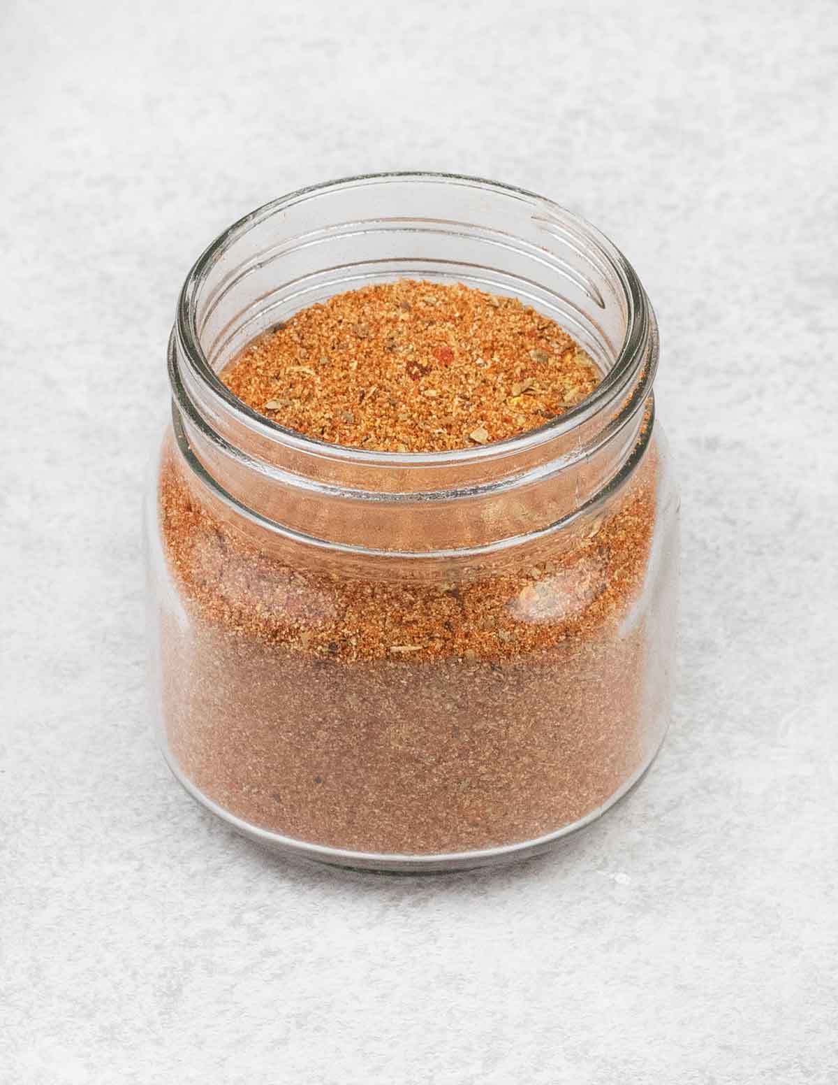 ground beef seasoning in a glass jar.