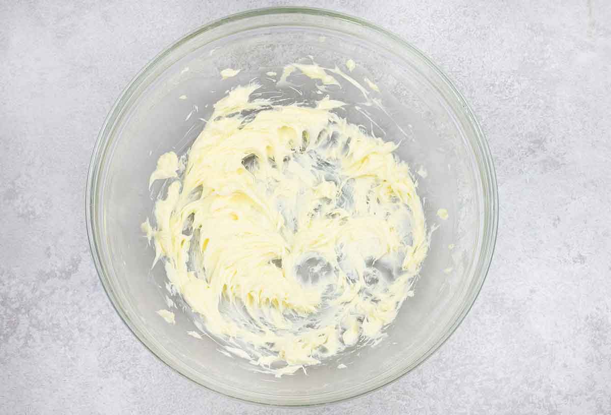 Beat the butter with an electric mixer until it is fluffy and smooth.