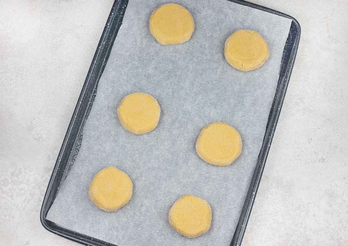 Press the cookies down with a cup to flatten them slightly.