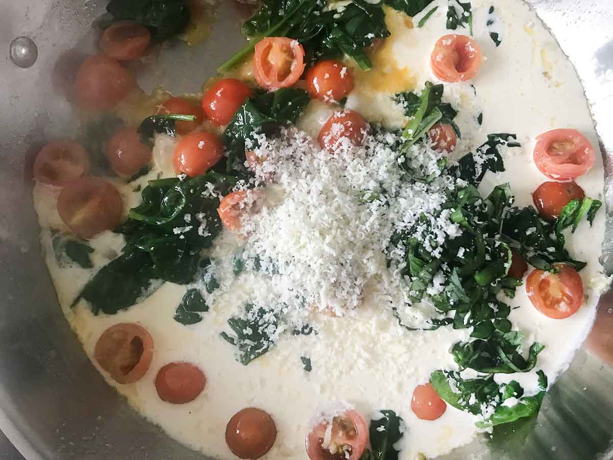 Stir in Parmesan cheese, heavy cream, and fresh basil.