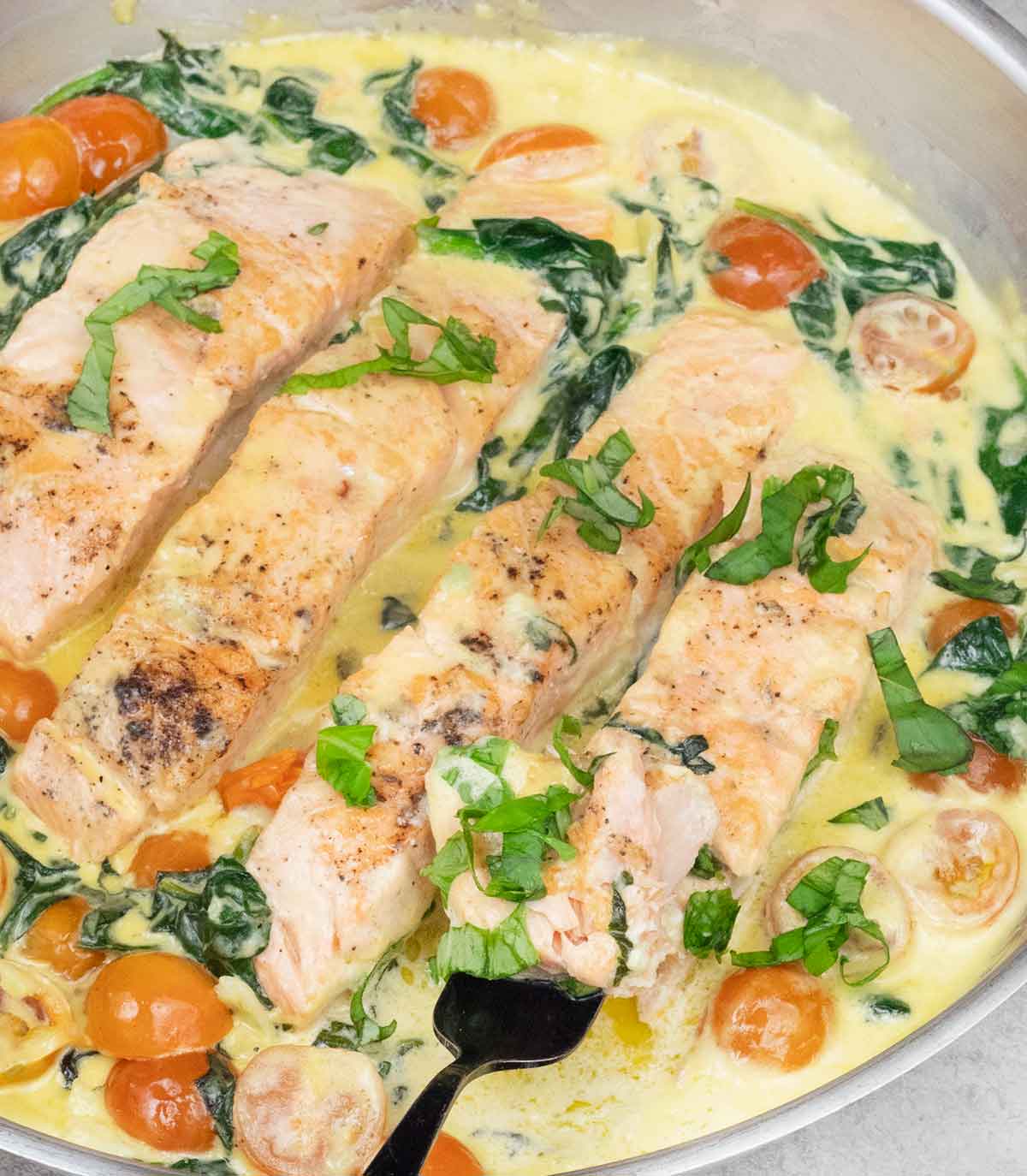 Tuscan salmon in a frying pan.