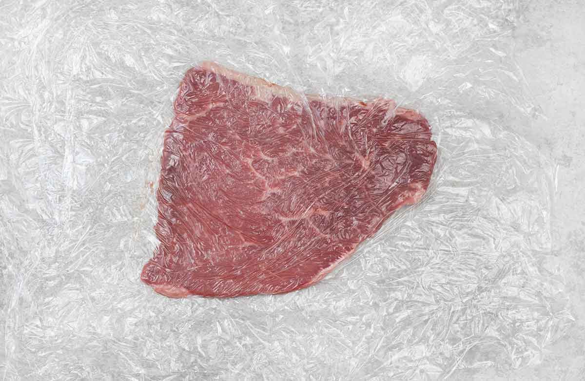 Put the beef cutlets one at a time between two pieces of plastic wrap and gently pound on it using a meat mallet.