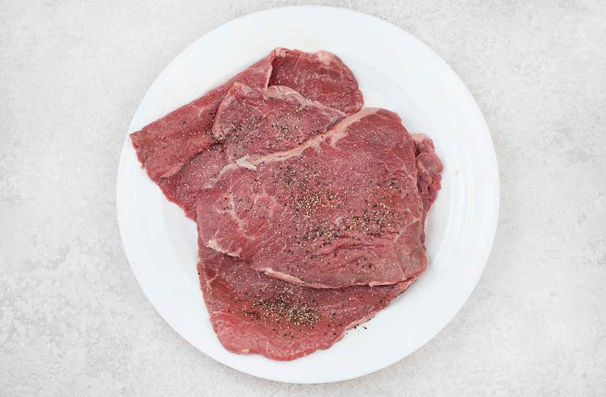 sprinkle both sides of the beef cutlets with salt and pepper.