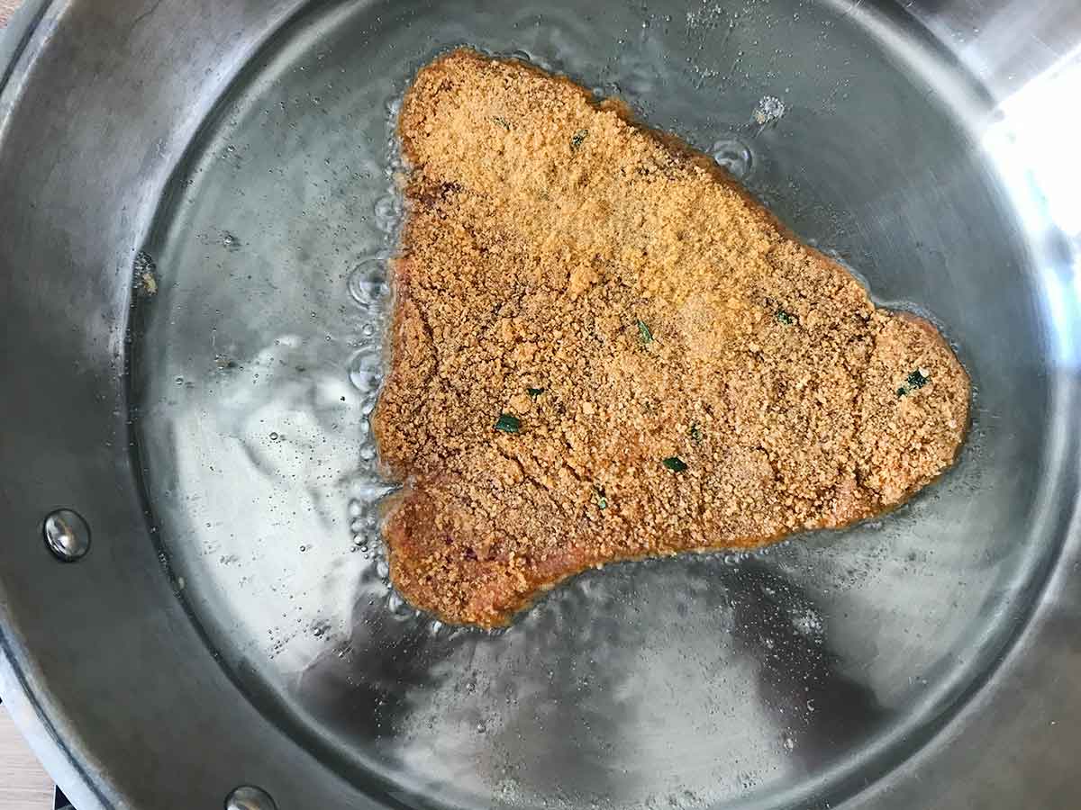 Cook the breaded cutlets in the hot oil for 2-3 minutes per side until crispy and golden brown.