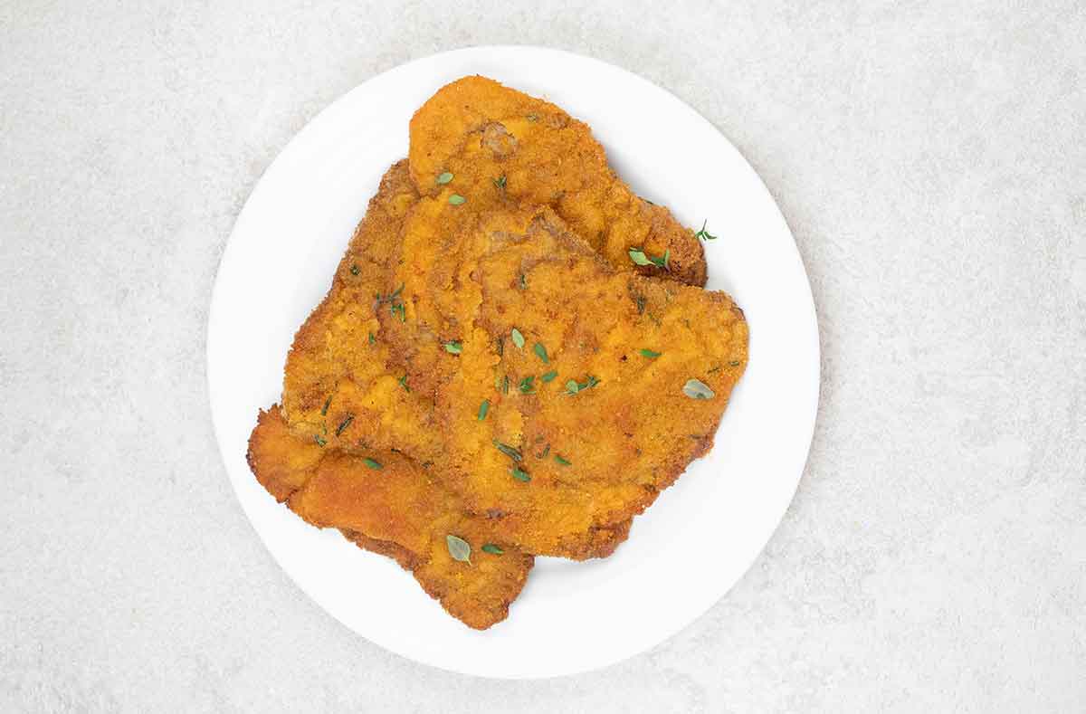 Garnish the beef cutlets with fresh thyme and serve warm.
