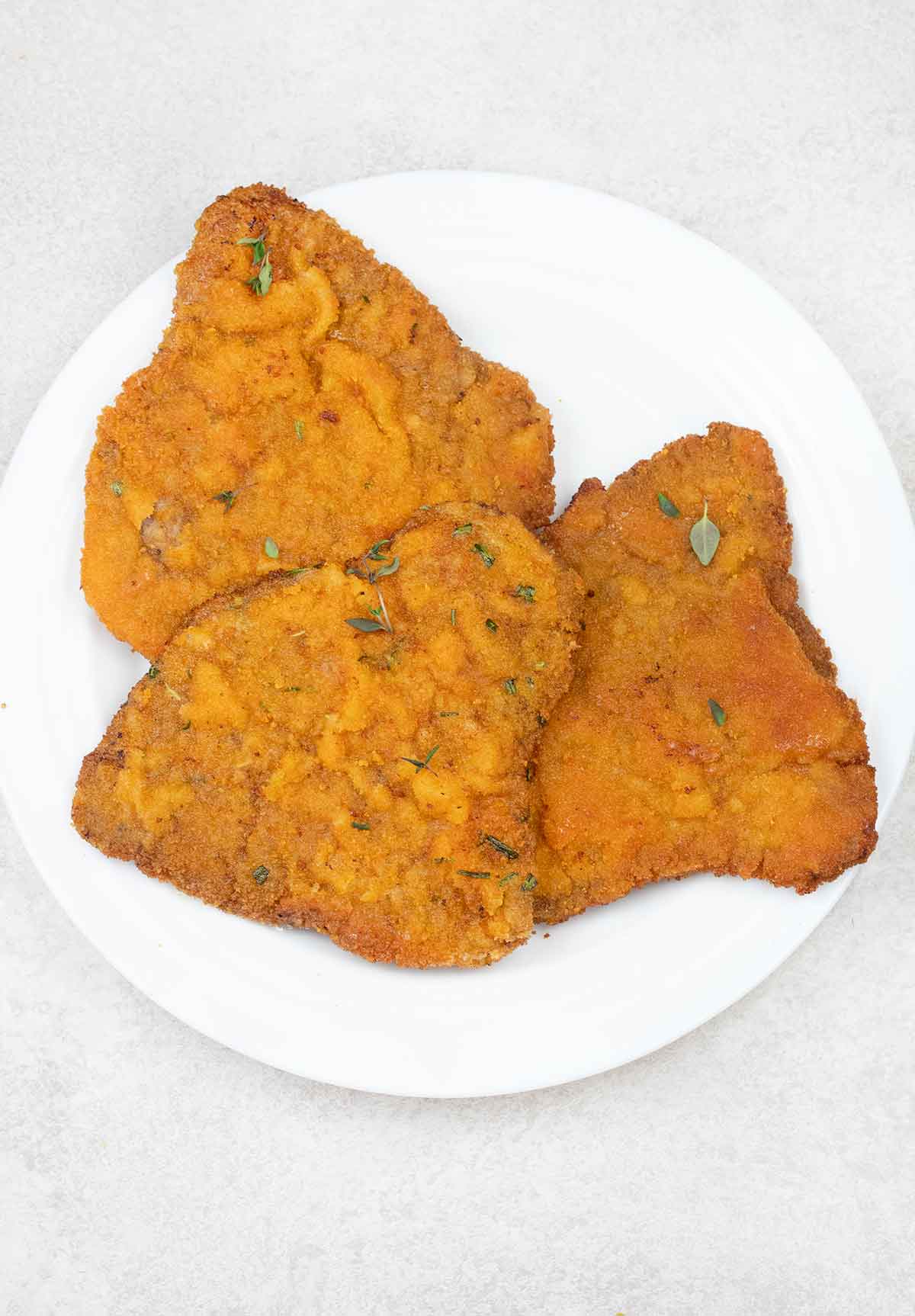 Beef cutlets in a serving plate.