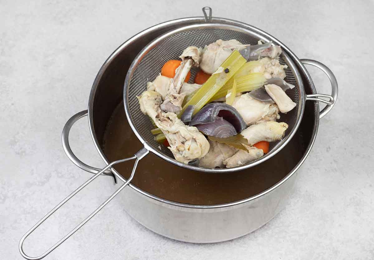 Use a colander to strain the broth.