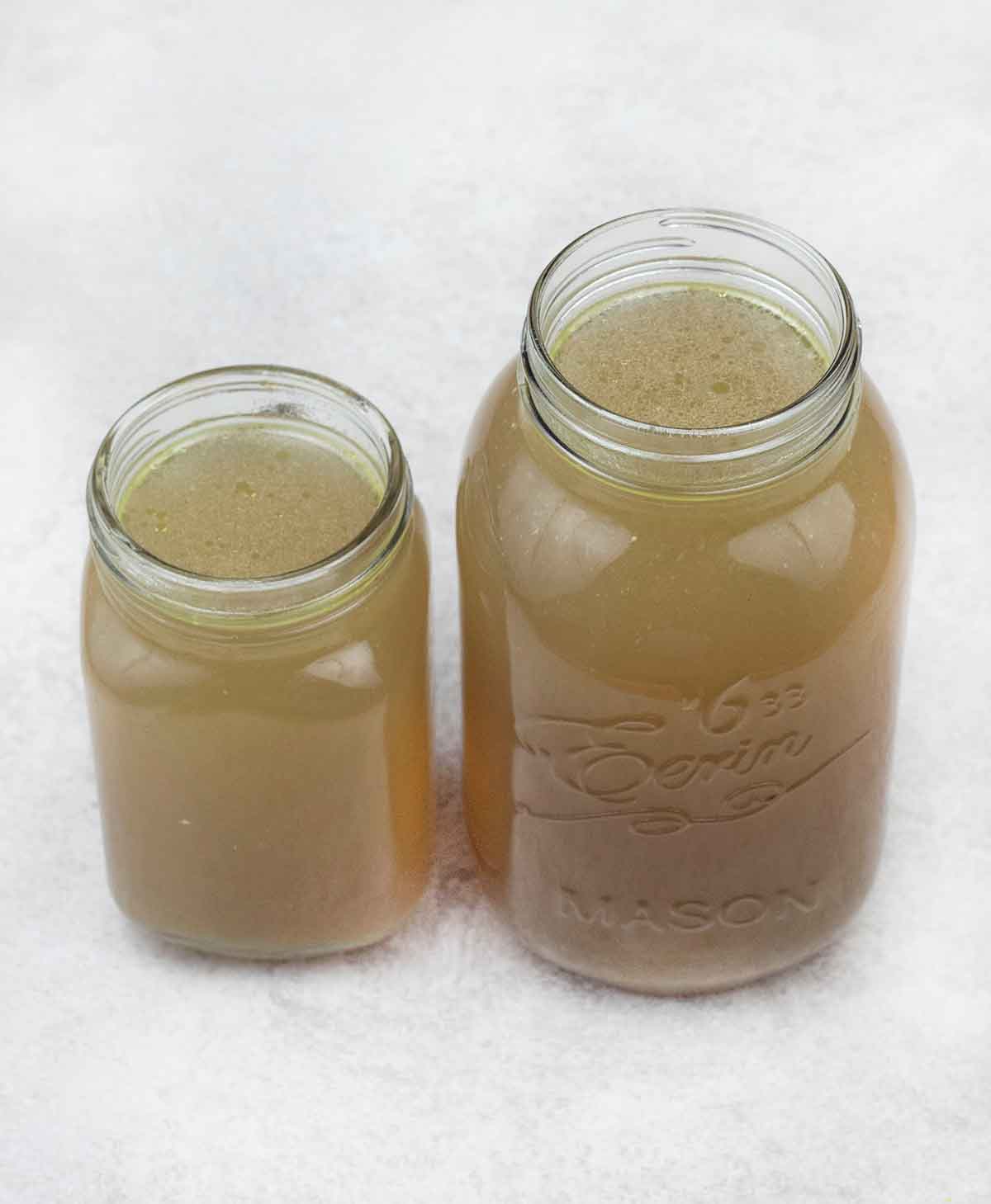 storing the homemade chicken broth in jars.