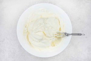 Now, fold the rest of the heavy cream mixer into the cream cheese mixture until combined.