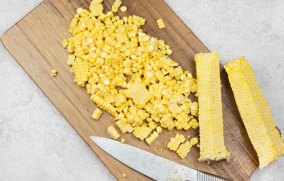 Use a sharp knife to cut the corn kernels from the cobs.