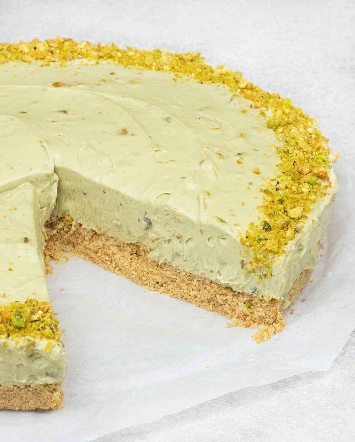 Remove the pistachio cheesecake from the springform pan and cut it to serve.