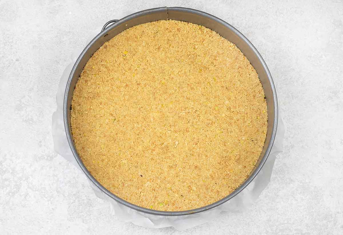 Press the mixture into the bottom of the springform pan.