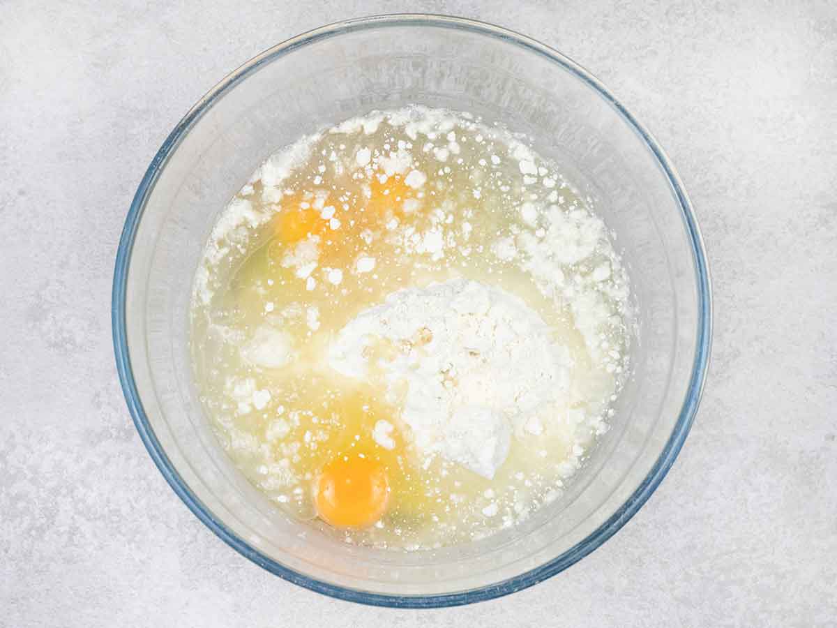 to make the cake, mix together the cake mix, 180 ml of water, sunflower oil and the eggs in a bowl.