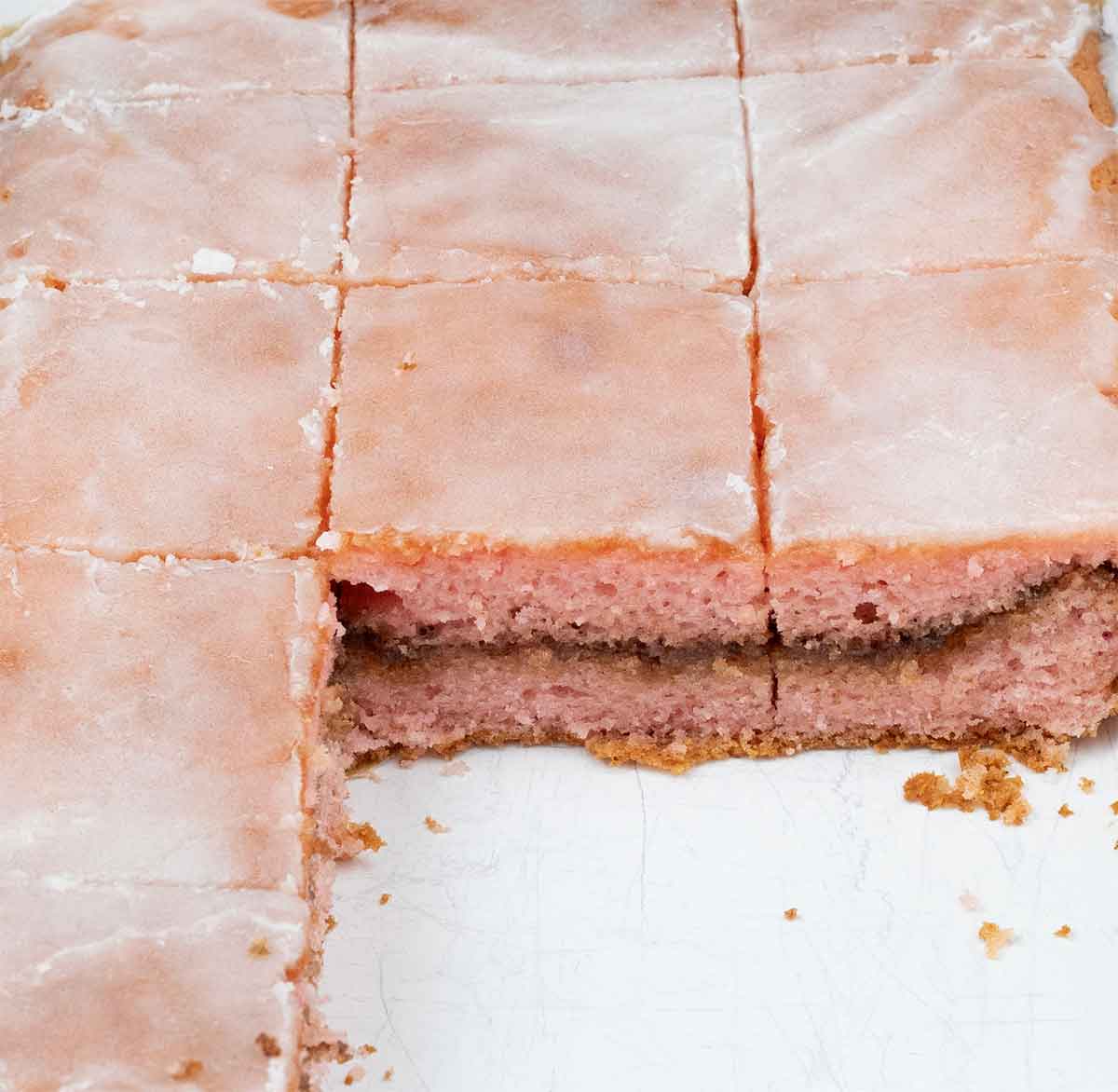Honey bun cake cut into squares.